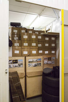 Crates of exhibition prints and publications in Mark Power's lock-up